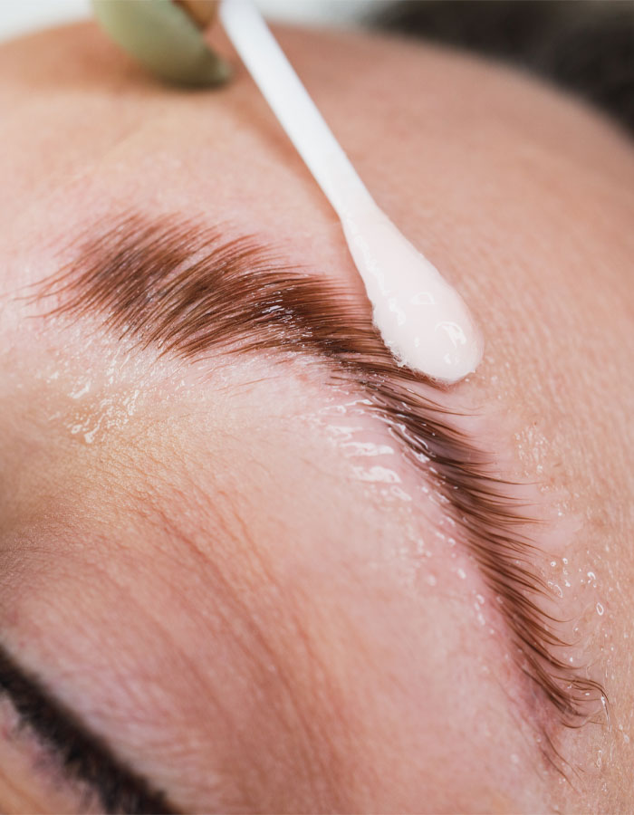 client receiving eyelash lamination service at nuessence spa